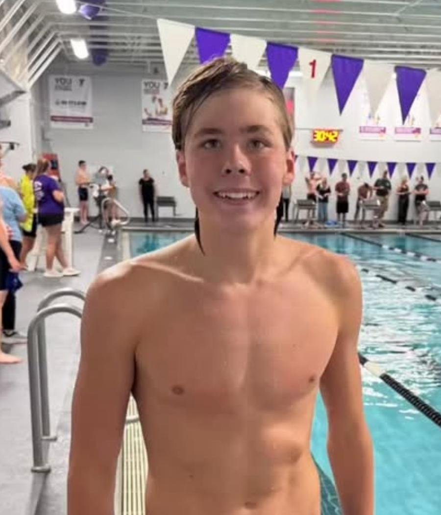 Swimmer on the pool deck after a race